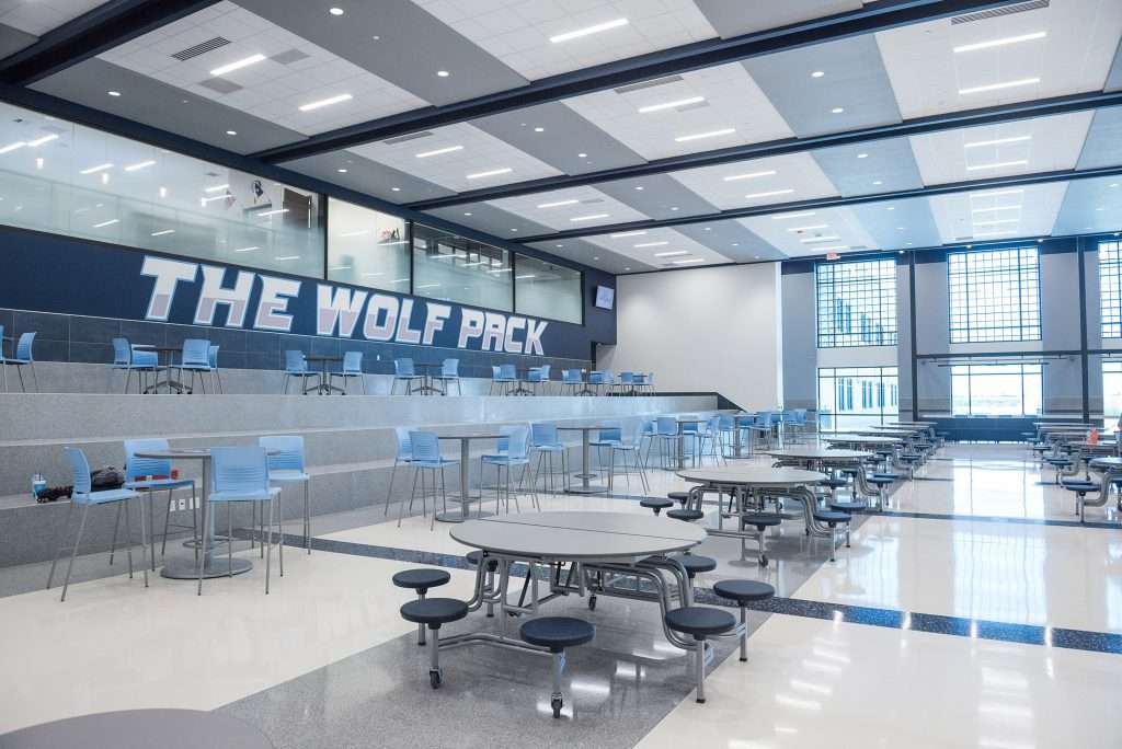 Highlights of the cafeteria include bright natural lighting and multiple seating opportunities for students. Like the rest of the campus, West Plains branding is prominent throughout this space. “Where I grew up in Dalhart, you only saw the logo of the mascot on the gym floor,” says Gomez. “But if you walk our school and pay attention, you see the brand everywhere. It’s one of my favorite things about this school.”